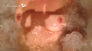 Melons in the jacuzzi tub watching breasts bounce and massaged by water